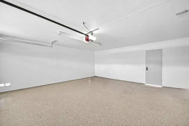 a view of a yard with wooden fence