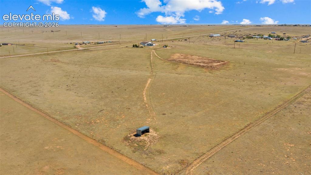 33975 Highway 94 Yoder, CO 80864 - Photo 34 of 40 Expansive open land with a small structure and visible dirt trails