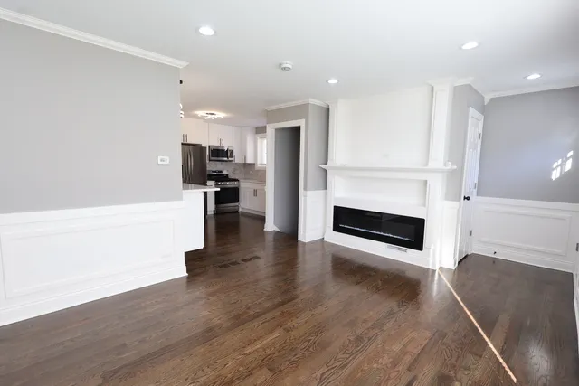 a view of kitchen with cabinets and wooden floor