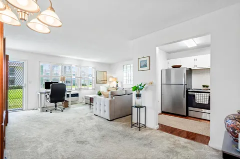 a bathroom with a toilet sink vanity and mirror