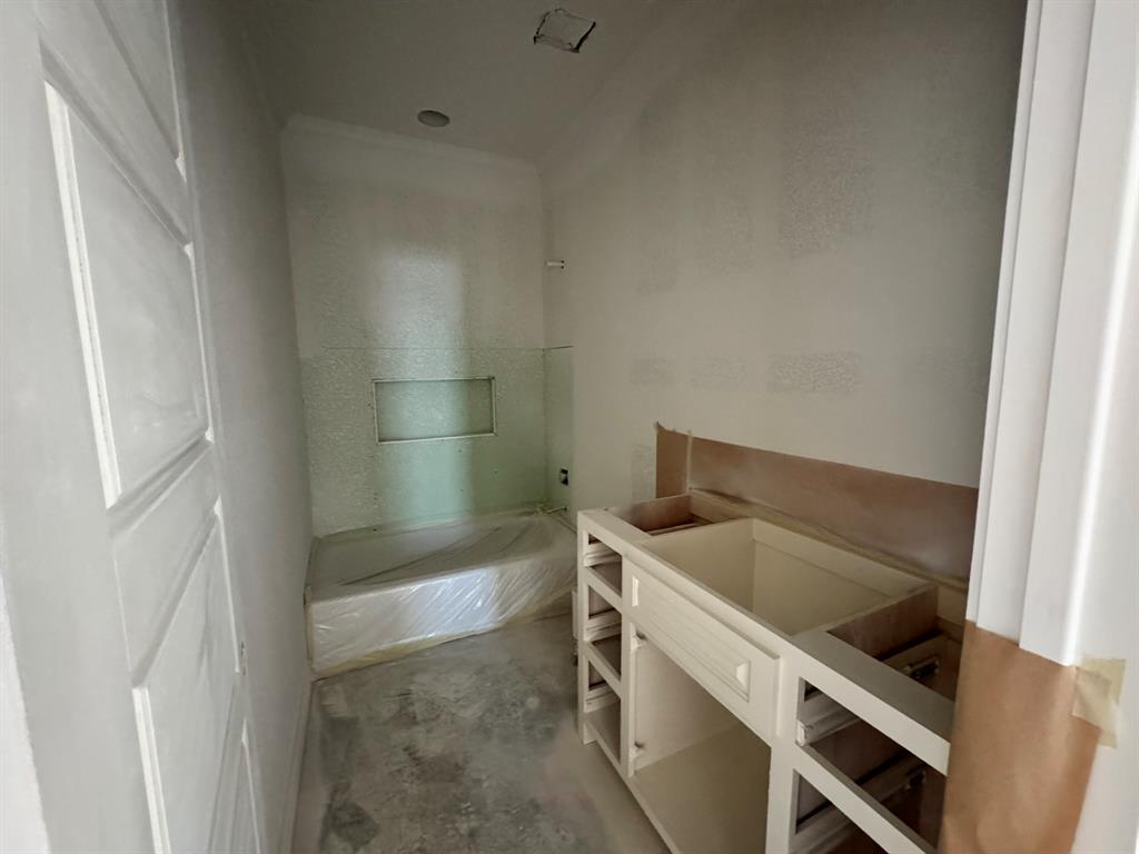 173 Willow Branch Road McGregor, TX 76657 - Photo 16 of 18 a bathroom with a tub sink and cabinets