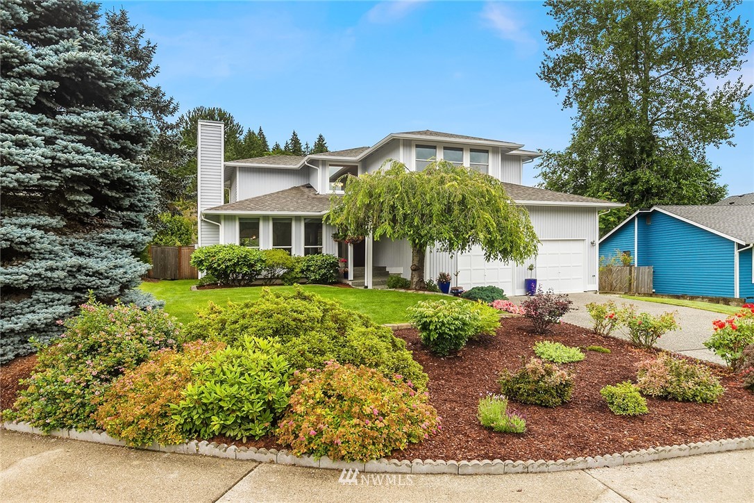 23423 9th Place West Bothell, WA 98021 - Photo 1 of 26 a front view of a house with a yard