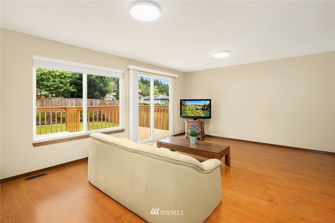 23423 9th Place West Bothell, WA 98021 - Photo 12 of 26 a living room with couch and a table