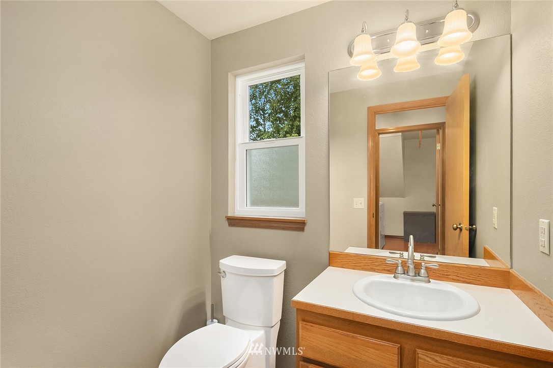 23423 9th Place West Bothell, WA 98021 - Photo 13 of 26 a bathroom with a sink and a mirror