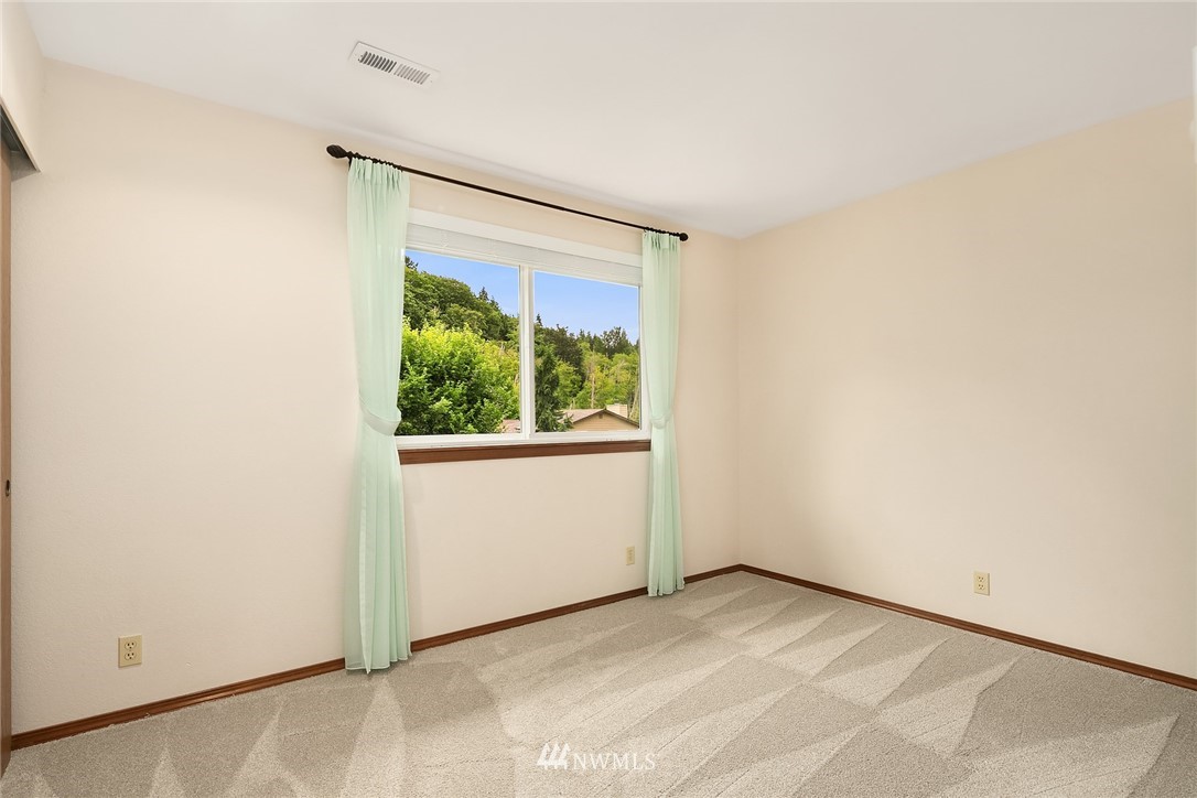 23423 9th Place West Bothell, WA 98021 - Photo 21 of 26 a view of an empty room with a window