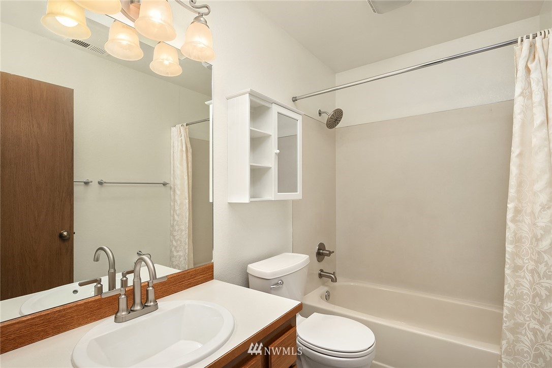 23423 9th Place West Bothell, WA 98021 - Photo 22 of 26 a bathroom with a sink toilet and shower