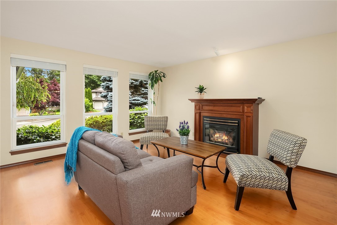 23423 9th Place West Bothell, WA 98021 - Photo 5 of 26 a living room with furniture and a fireplace
