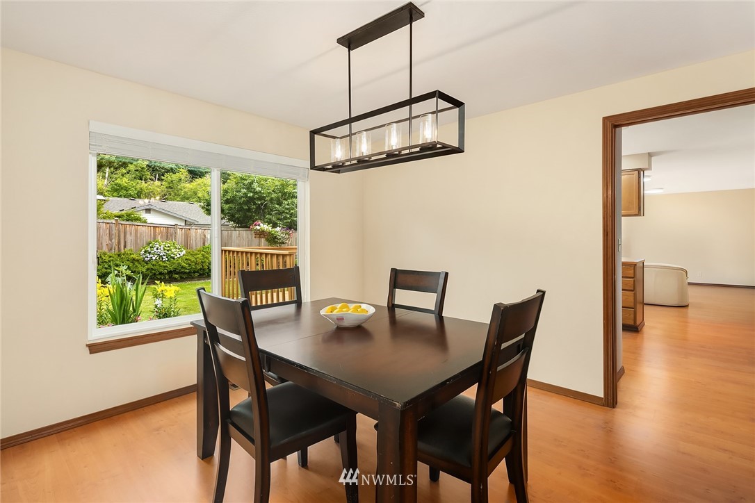 23423 9th Place West Bothell, WA 98021 - Photo 6 of 26 a view of a dining room with furniture window and wooden floor