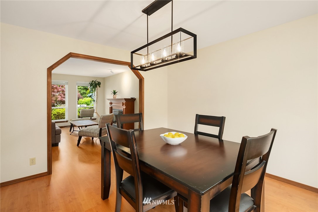 23423 9th Place West Bothell, WA 98021 - Photo 7 of 26 a view of a dining room with furniture and wooden floor