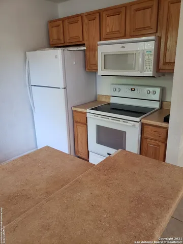 a kitchen with a stove and a microwave