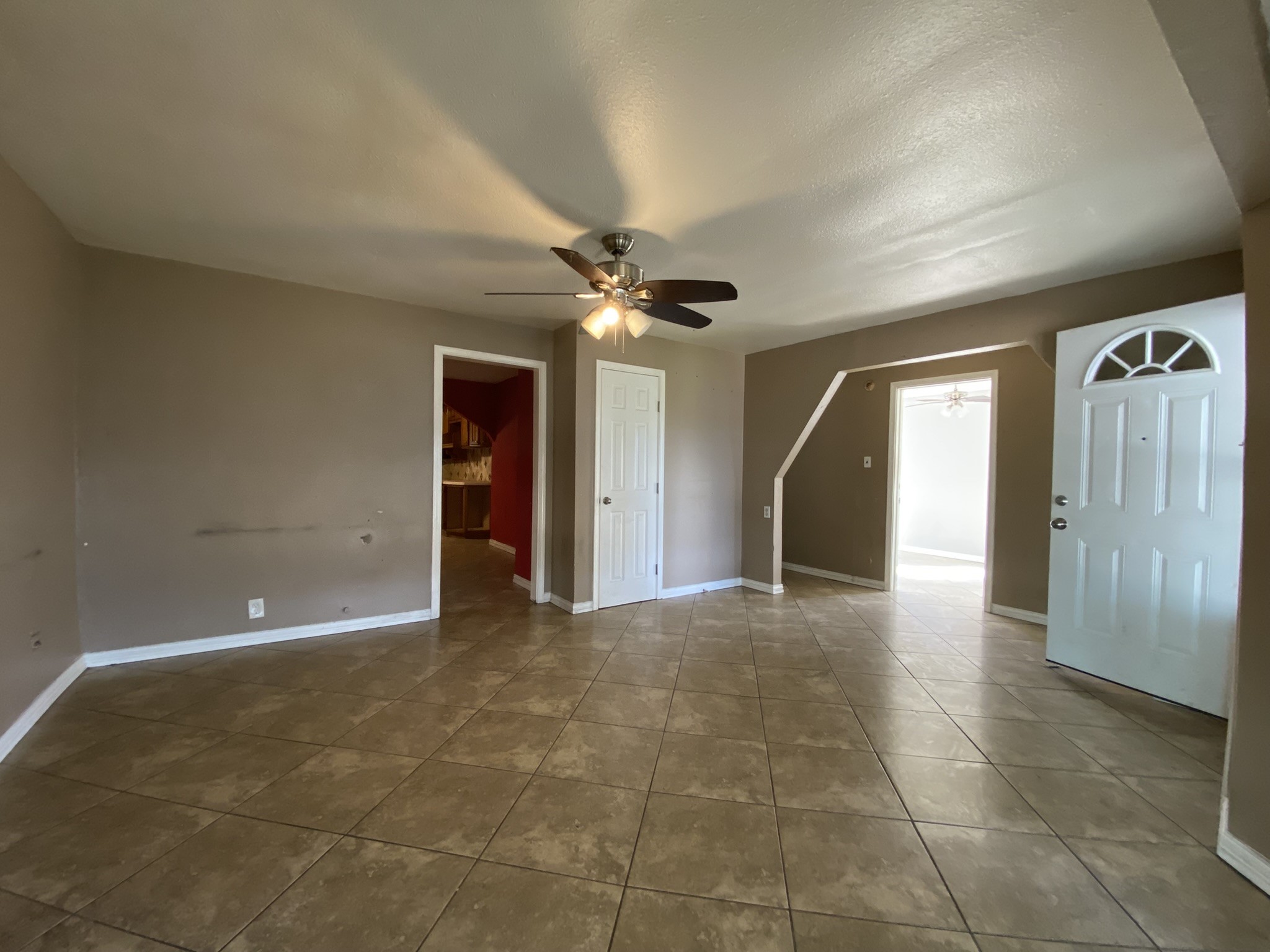 3013 Fern Street Pasadena, TX 77503 - Photo 15 of 23 a view of a livingroom with a chandelier fan and windows