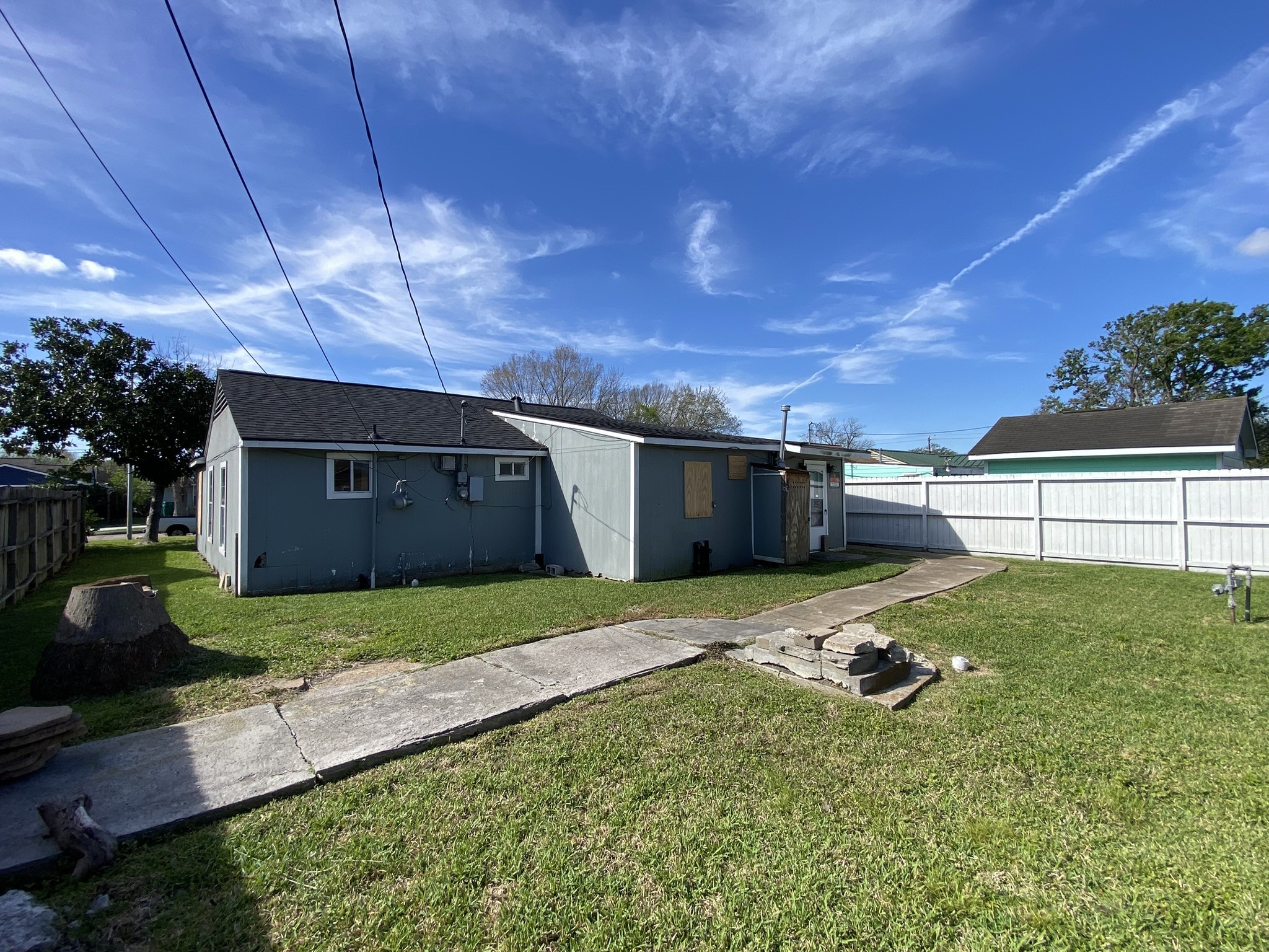 3013 Fern Street Pasadena, TX 77503 - Photo 4 of 23 a house with green field in front of it