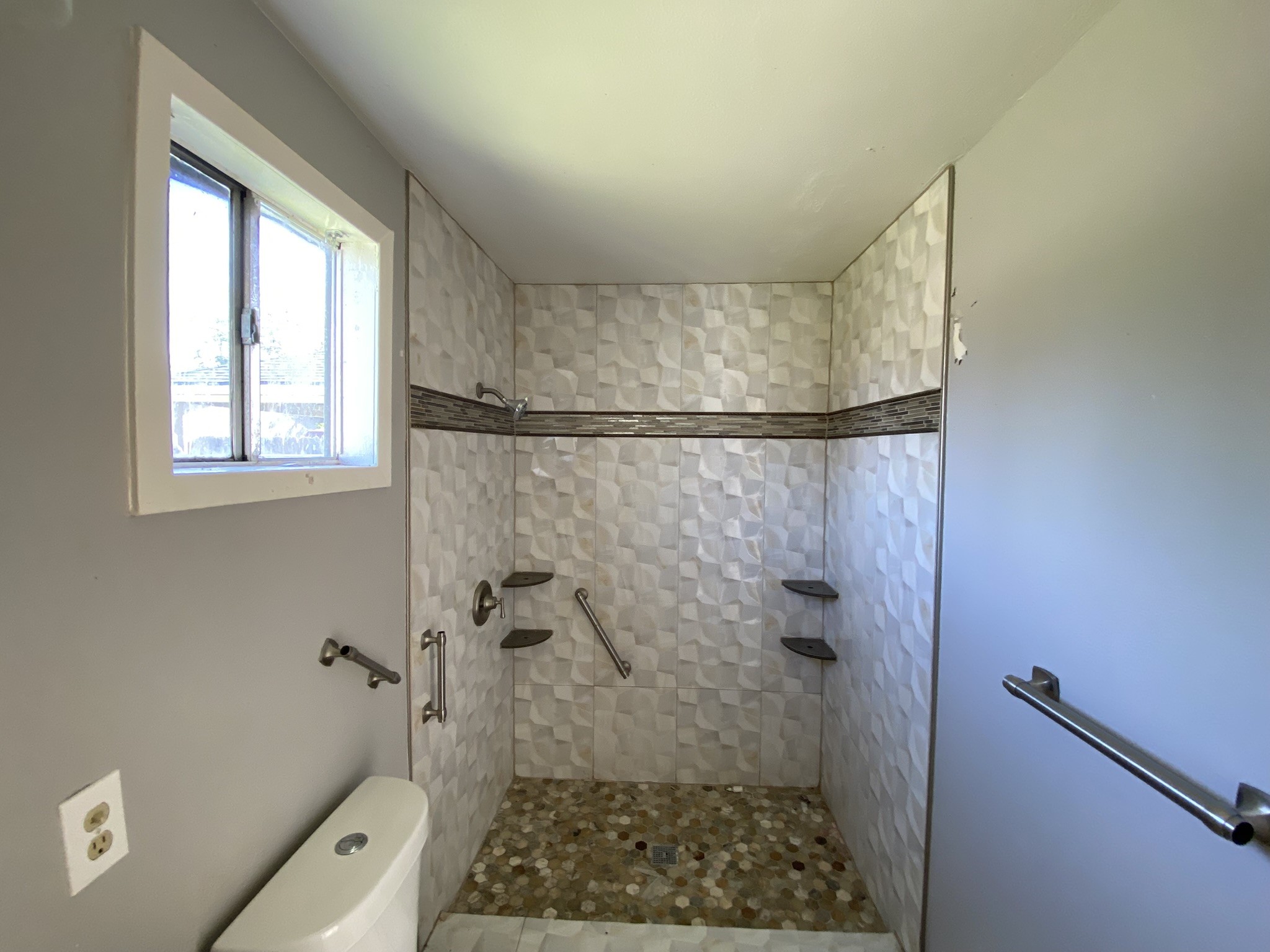 3013 Fern Street Pasadena, TX 77503 - Photo 10 of 23 a bathroom with a shower and a toilet