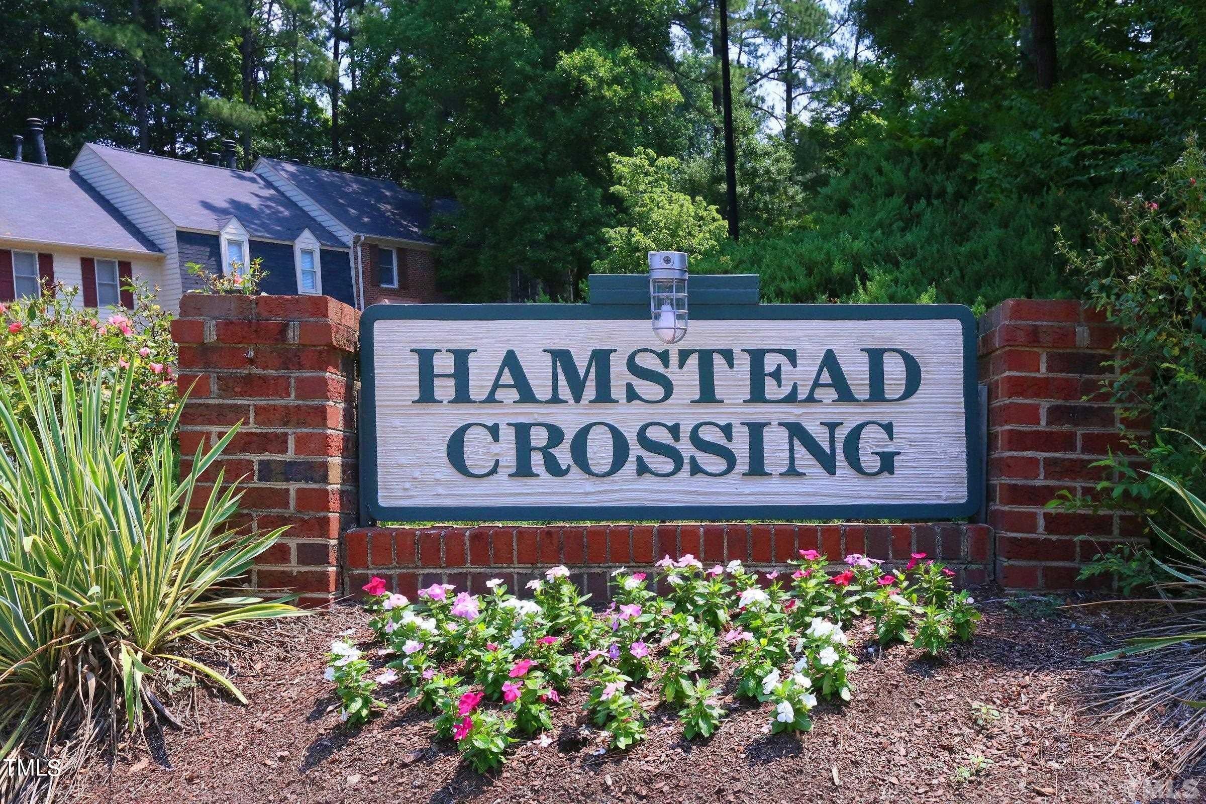 5656 Hamstead Crossing Raleigh, NC 27612 - Photo 33 of 35 a sign on the side of the building