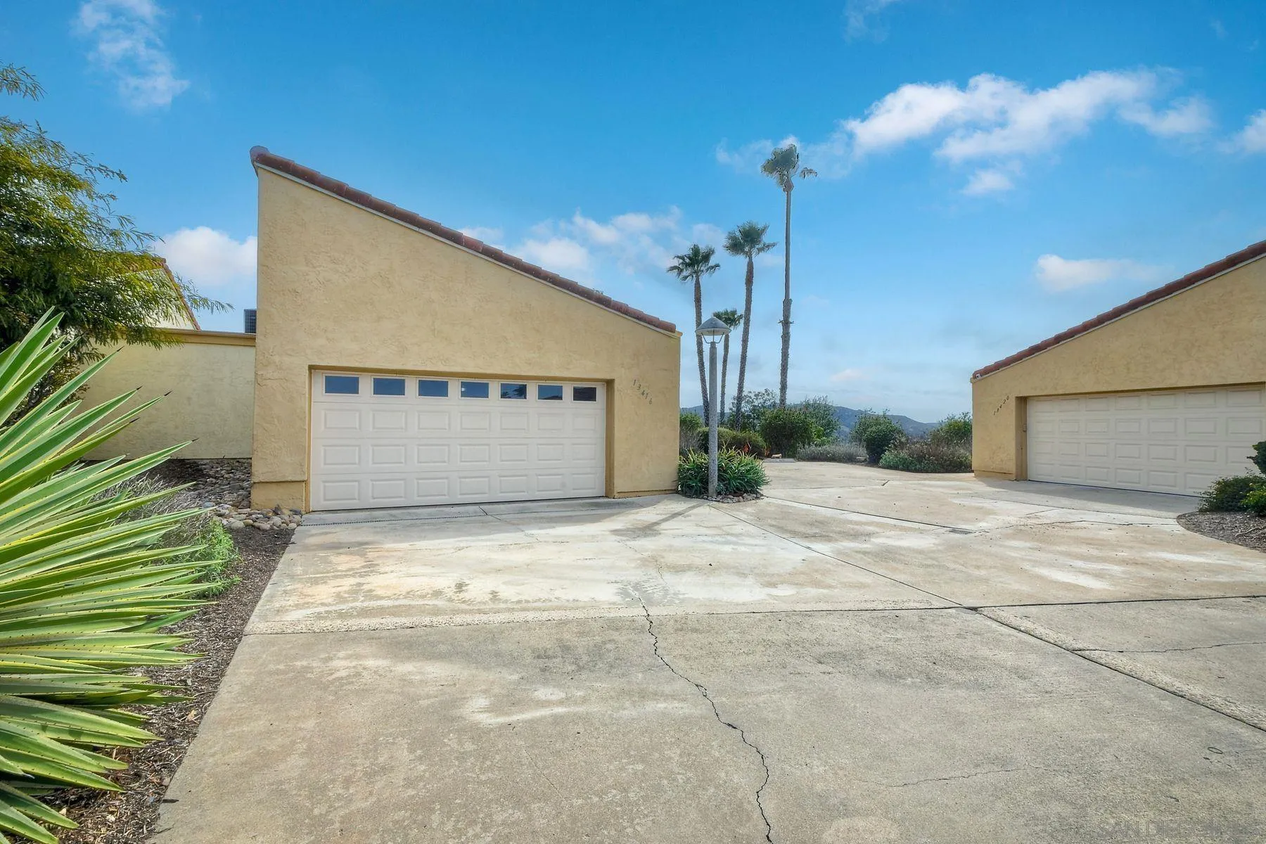 a view of a house with a yard and garage