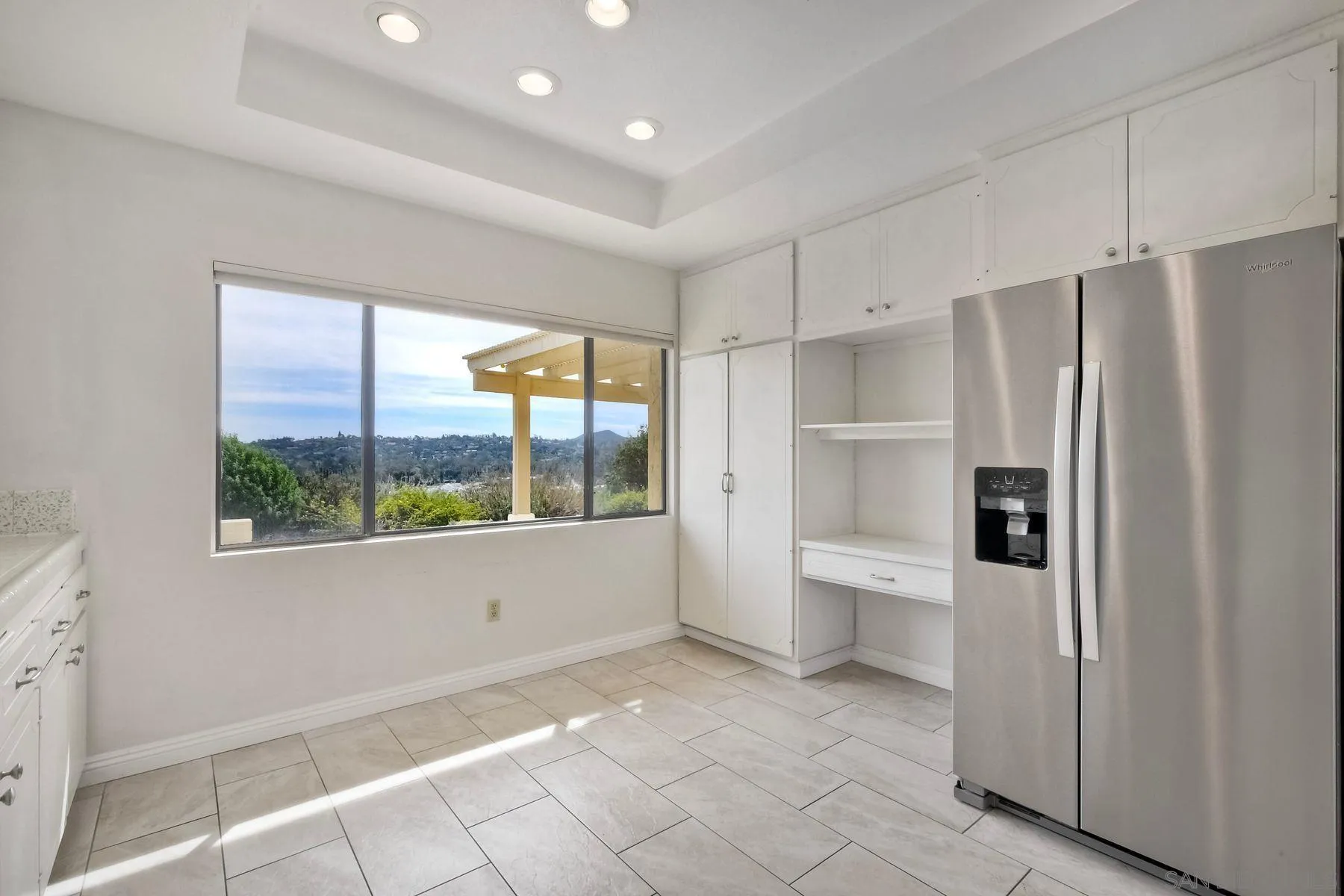 13416 The Square Poway, CA 92064 - Photo 12 of 22 a kitchen with stainless steel appliances a refrigerator and a sink