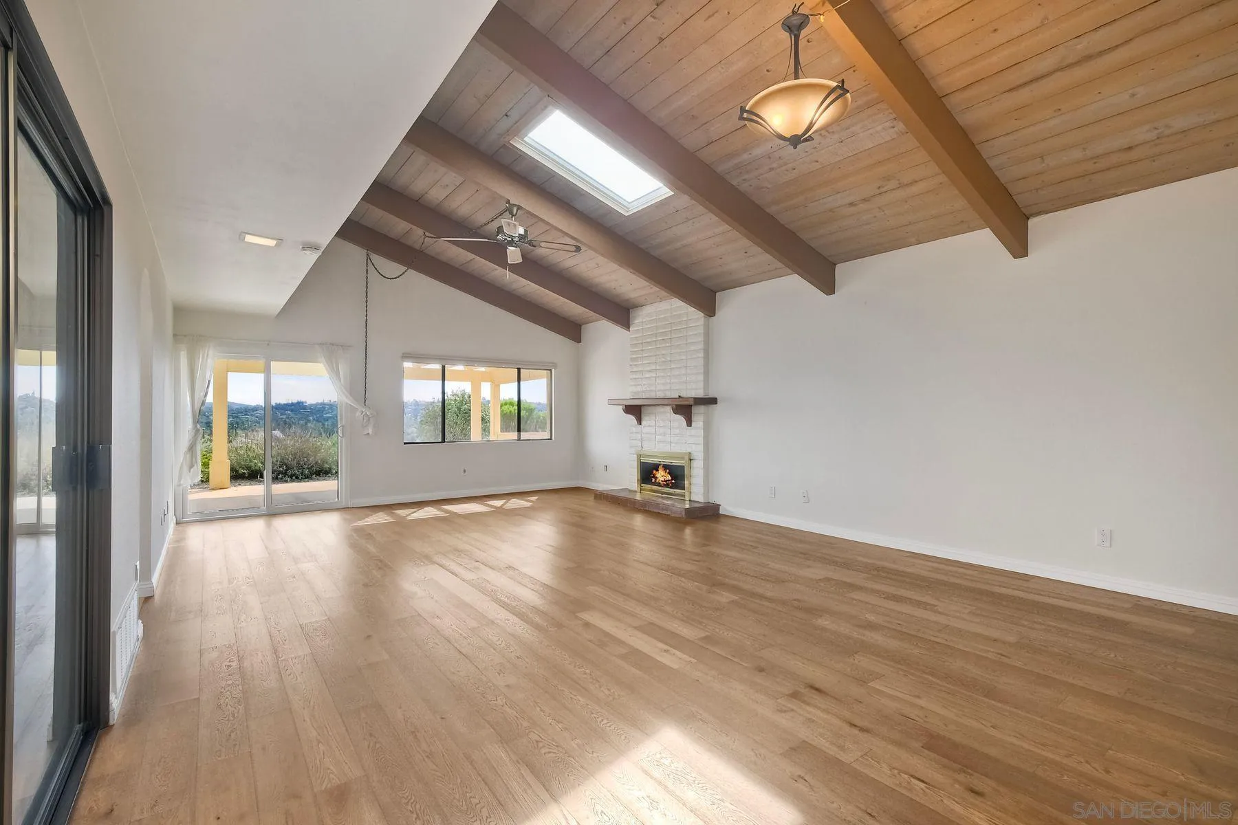 13416 The Square Poway, CA 92064 - Photo 6 of 22 an empty room with wooden floor and windows