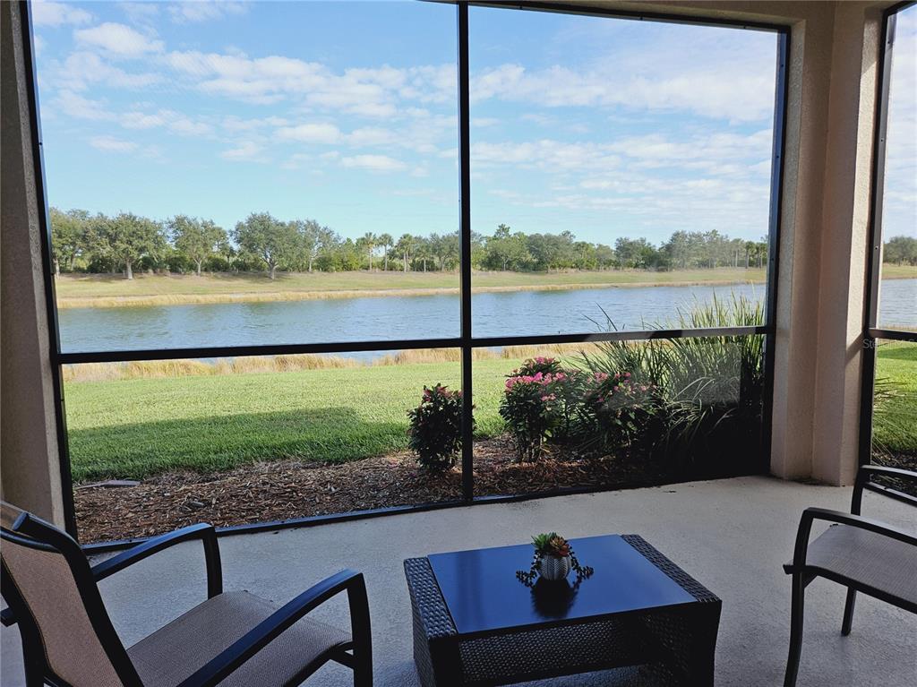 10468 Crooked Creek Drive Venice, FL 34293 - Photo 11 of 44 a view of a lake from a balcony