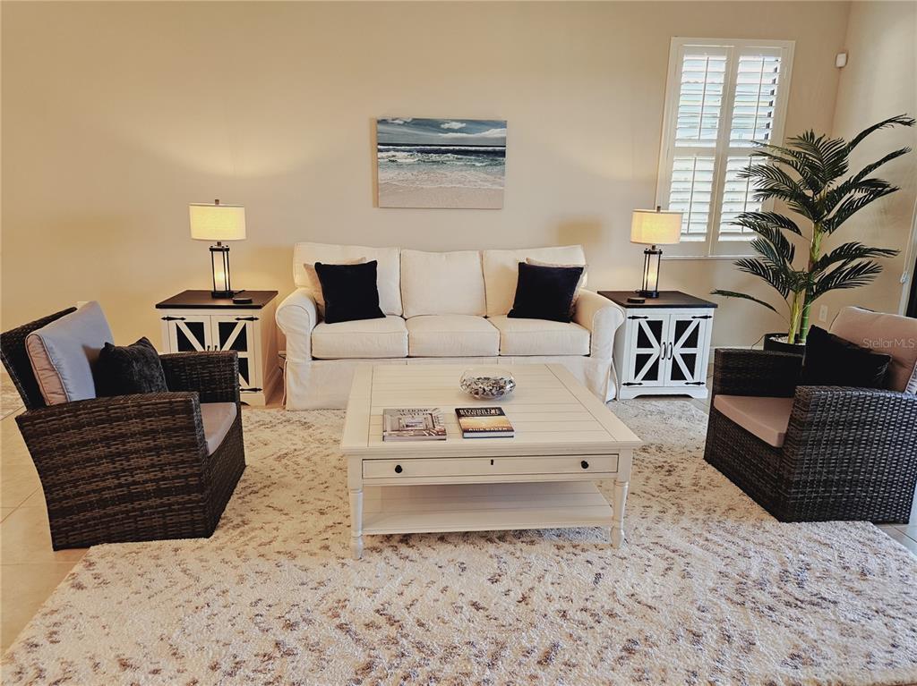 10468 Crooked Creek Drive Venice, FL 34293 - Photo 9 of 44 a living room with furniture and wooden floor