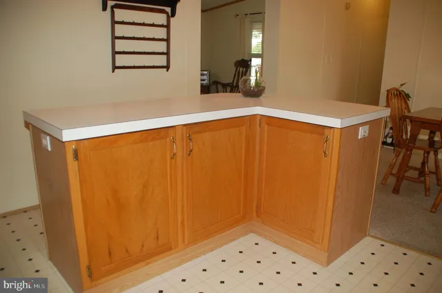 a bedroom with a bed and a chandelier fan