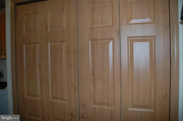a large kitchen with a table and chairs