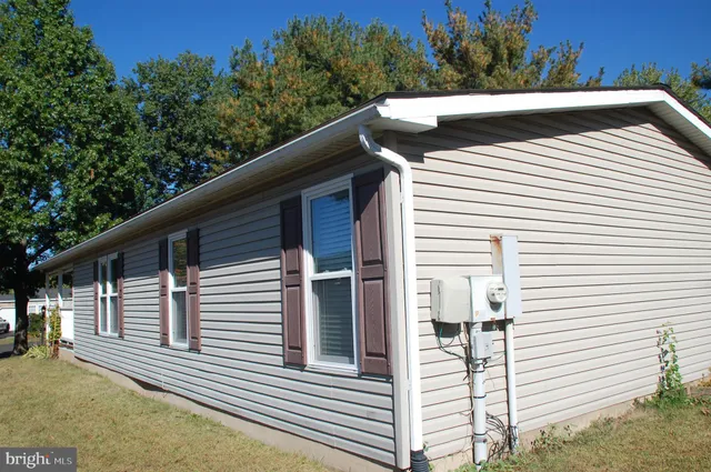 an outdoor space with lots of tables and chairs