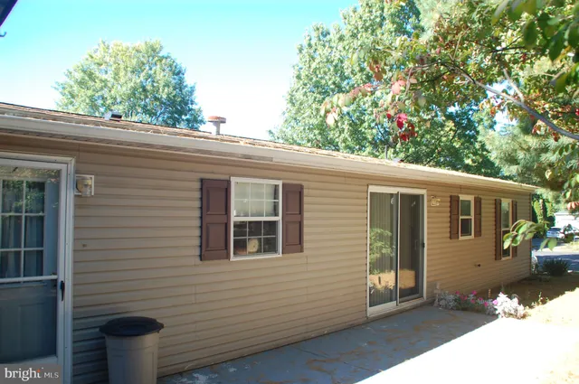 a kitchen with granite countertop a sink and cabinets