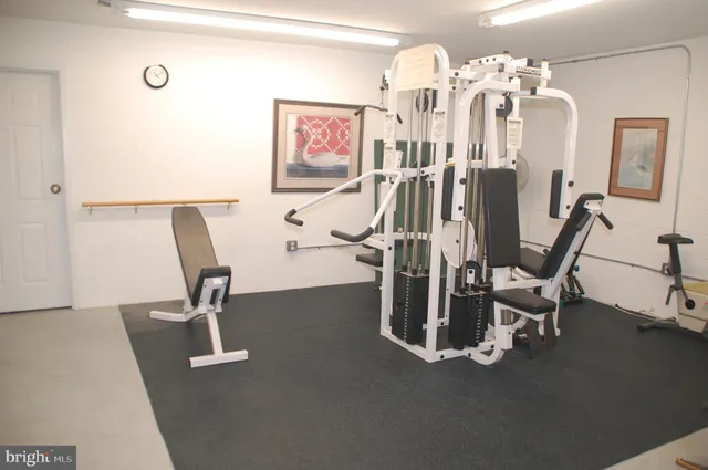 an aerial view of lake residential house with outdoor space and trees all around
