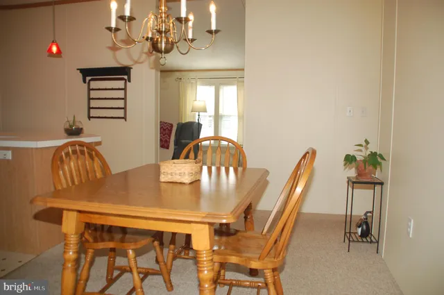 a kitchen with a sink a refrigerator and a window