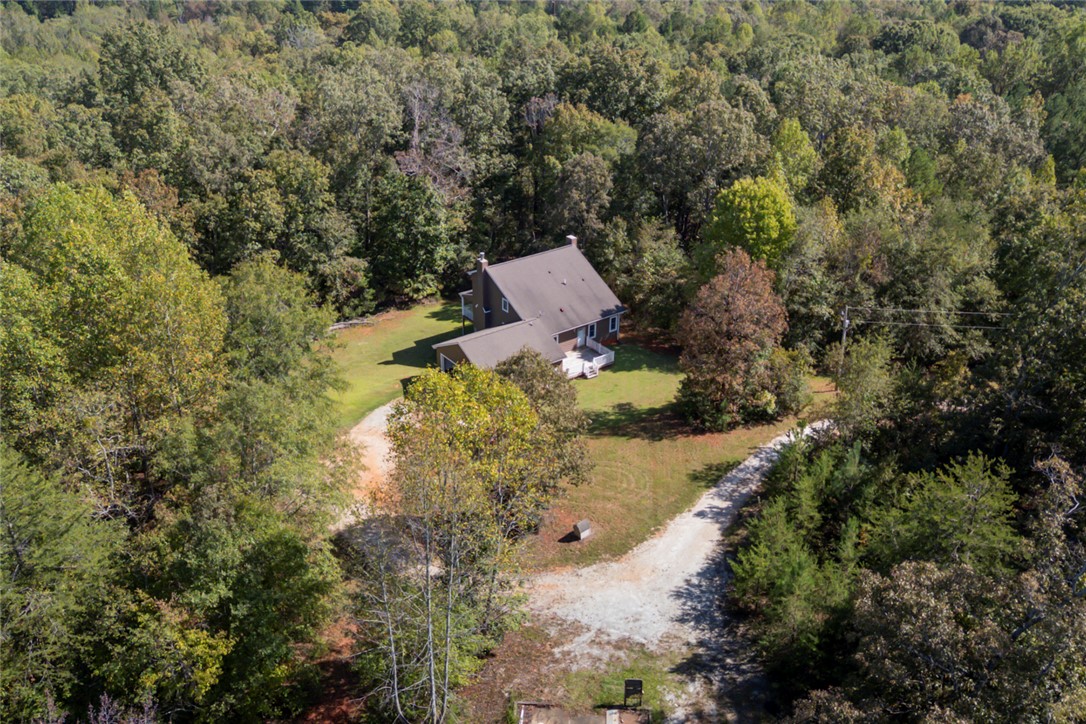 621 Burns Mill Road West Union, SC 29696 - Photo 35 of 45 A secluded dwelling is nestled amidst a lush forest, offering privacy and natural beauty.