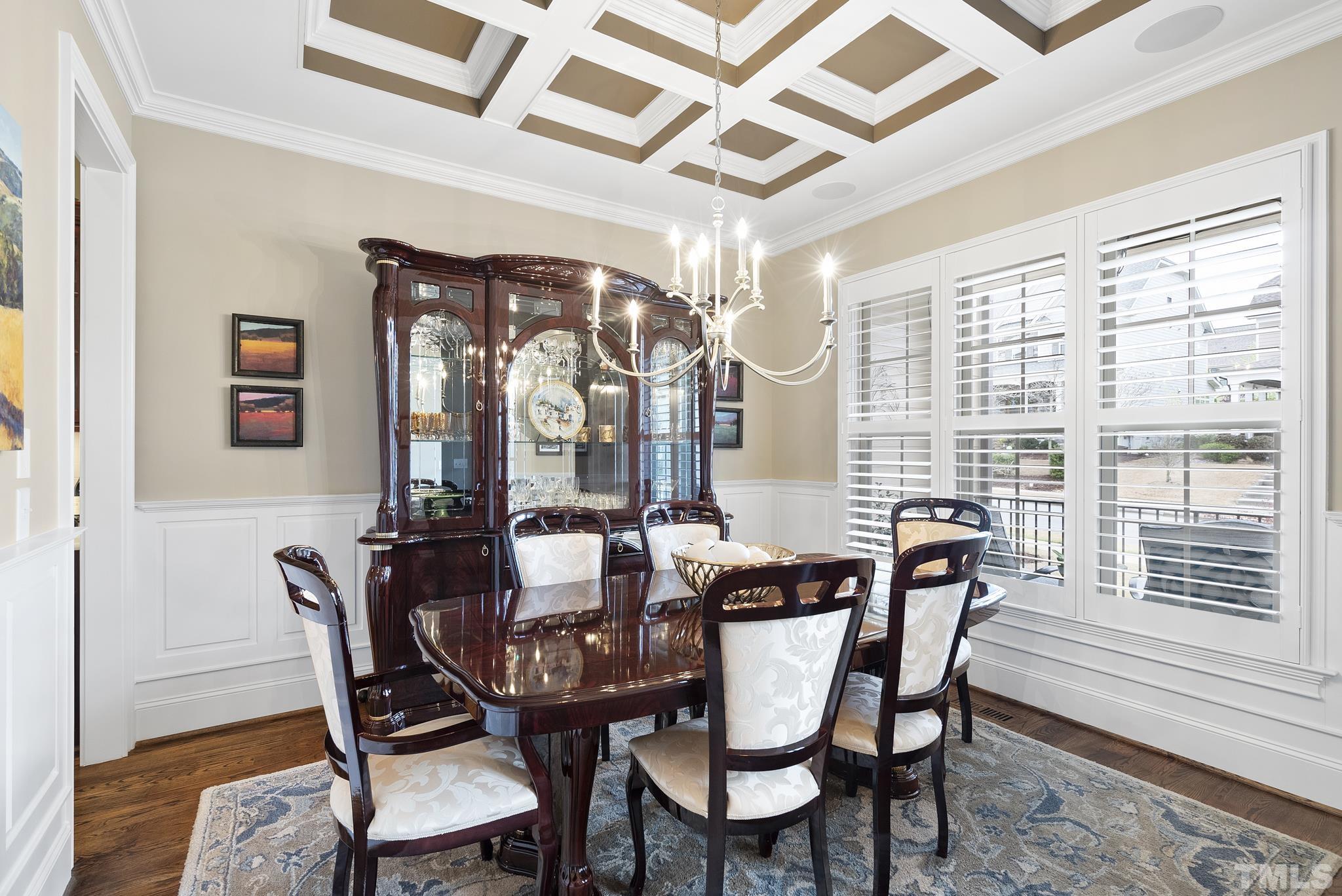 2524 Highgate Oak Drive Cary, NC 27519 - Photo 12 of 70 a dining room with furniture a chandelier and wooden floor