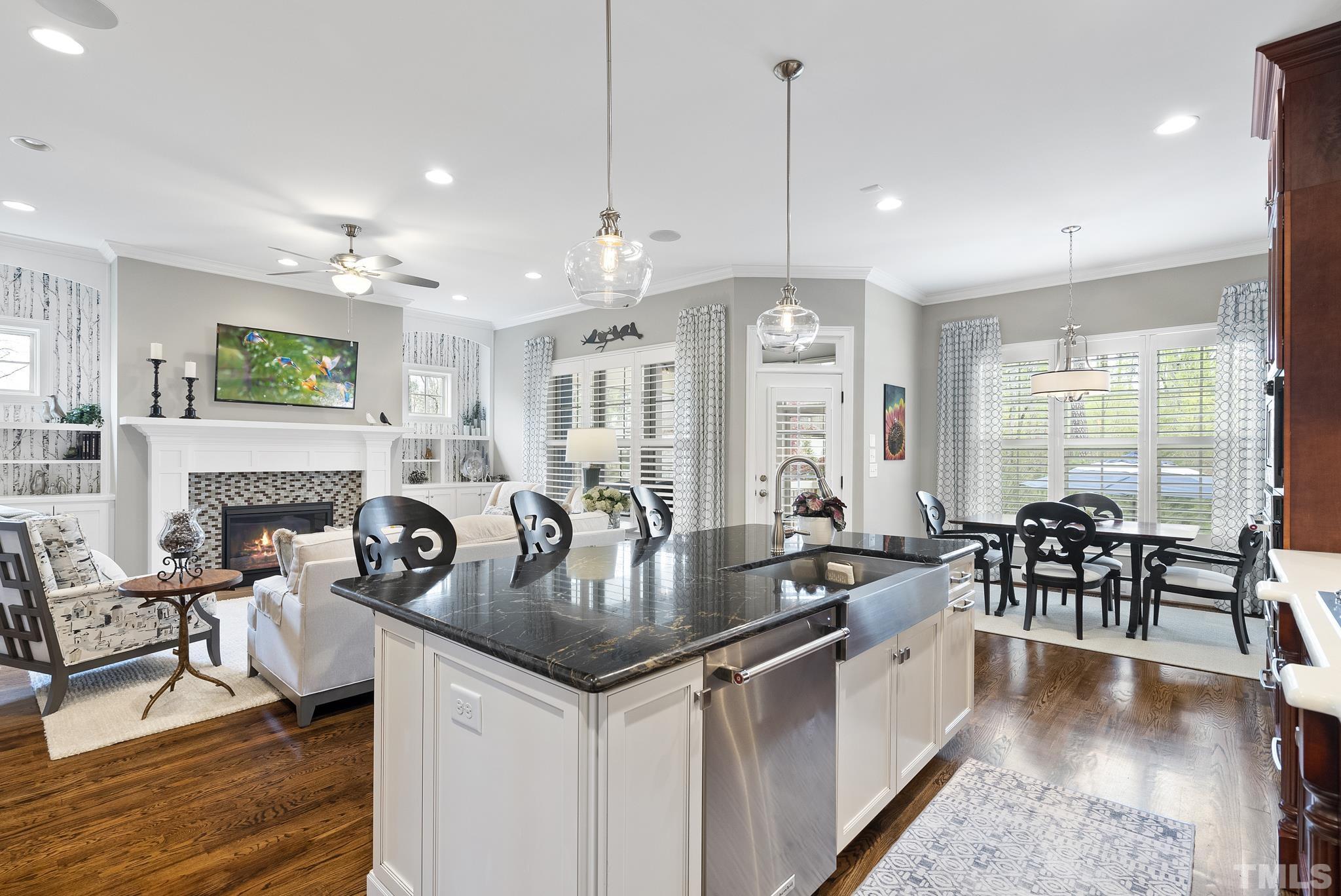 2524 Highgate Oak Drive Cary, NC 27519 - Photo 18 of 70 a kitchen with counter space dining table and chairs