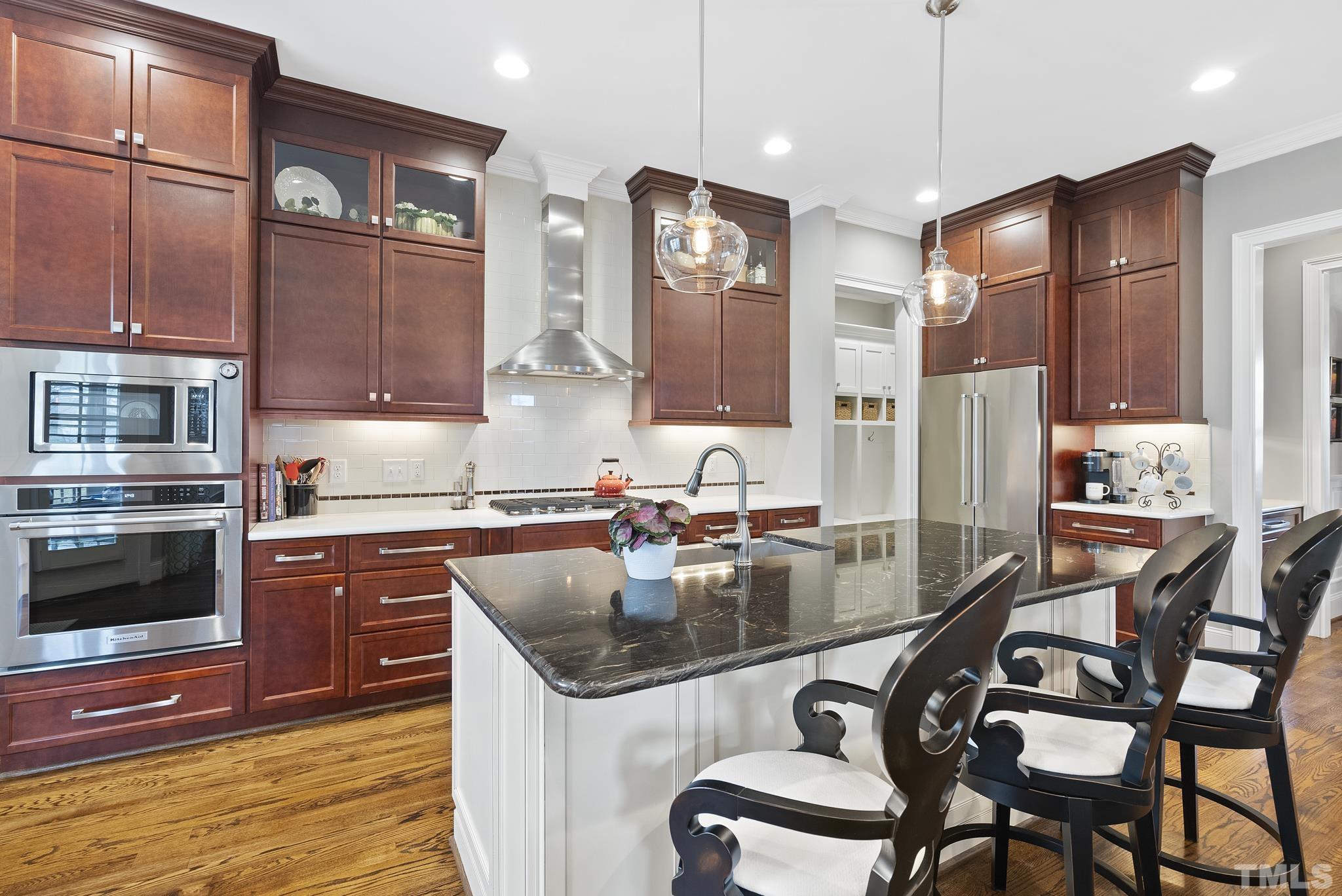 2524 Highgate Oak Drive Cary, NC 27519 - Photo 22 of 70 a kitchen with granite countertop a sink appliances and cabinets