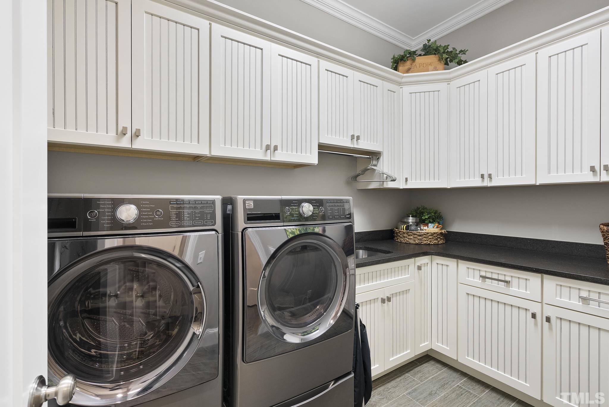 2524 Highgate Oak Drive Cary, NC 27519 - Photo 27 of 70 a utility room with sink dryer and washer