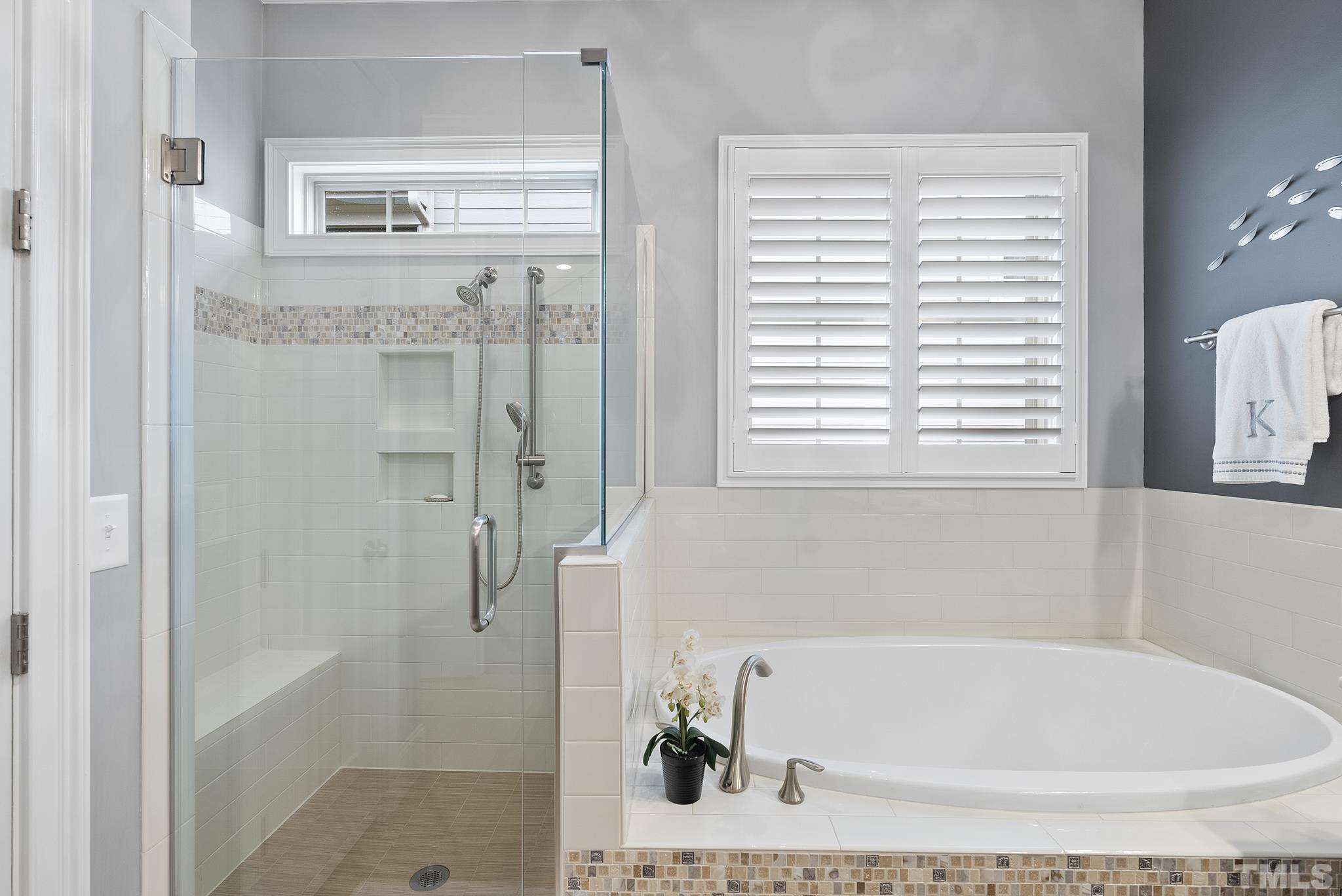 2524 Highgate Oak Drive Cary, NC 27519 - Photo 34 of 70 a bathroom with a tub shower and a sink
