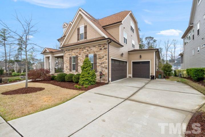 2524 Highgate Oak Drive Cary, NC 27519 - Photo 4 of 70 a view of a white house with a yard