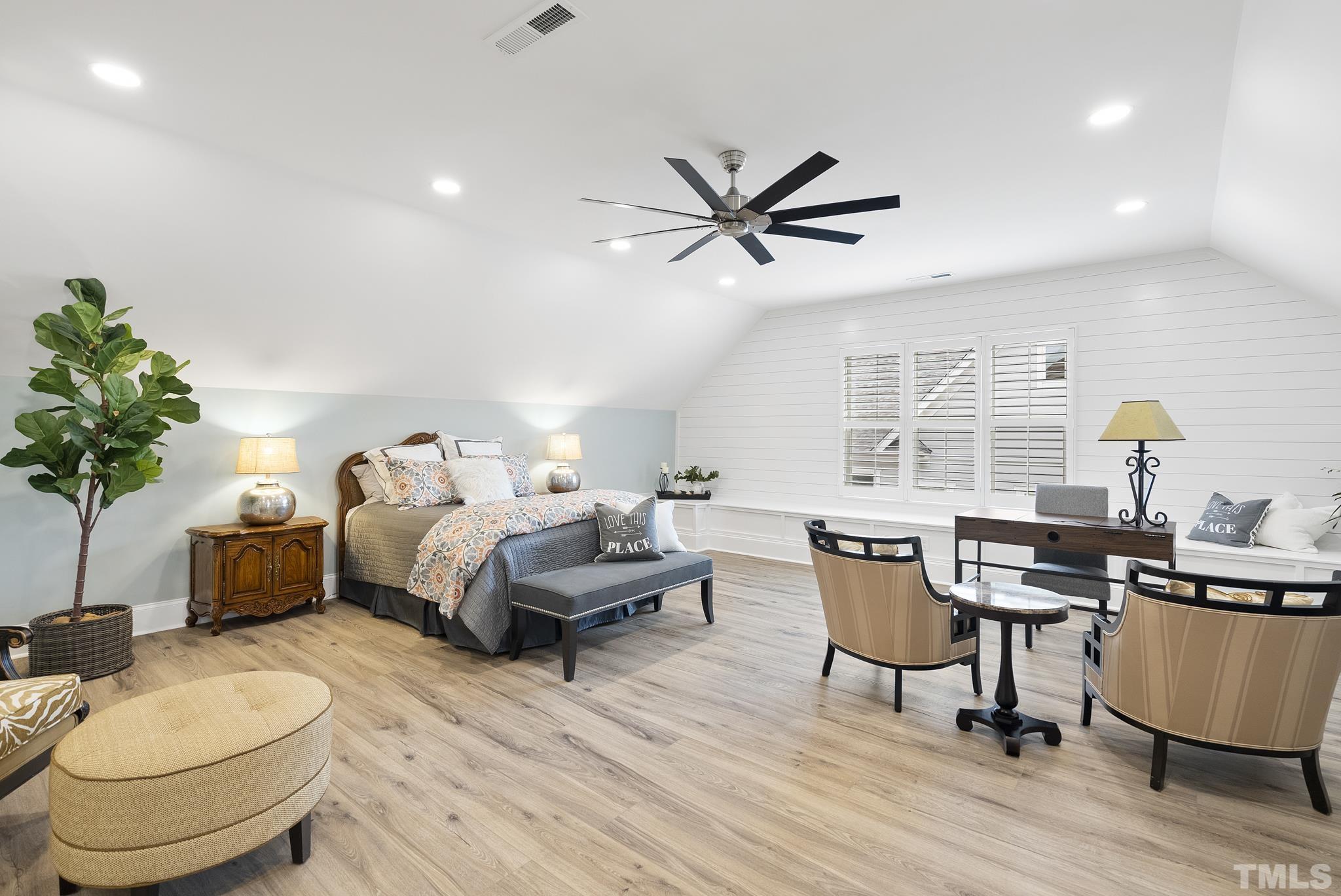 2524 Highgate Oak Drive Cary, NC 27519 - Photo 50 of 70 a bedroom with a bed a desk and chair with wooden floor
