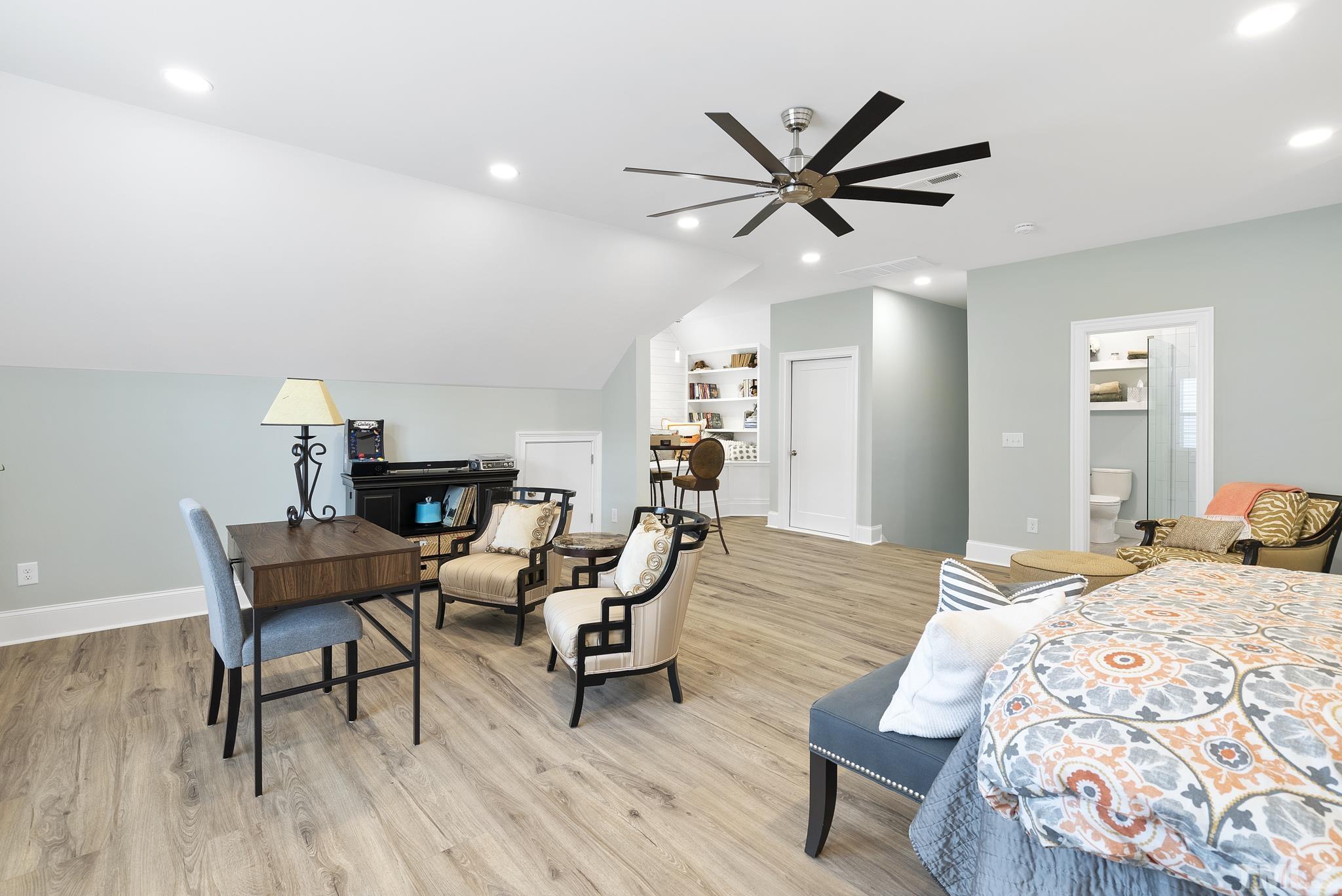 2524 Highgate Oak Drive Cary, NC 27519 - Photo 52 of 70 a bedroom with furniture and a wooden floor
