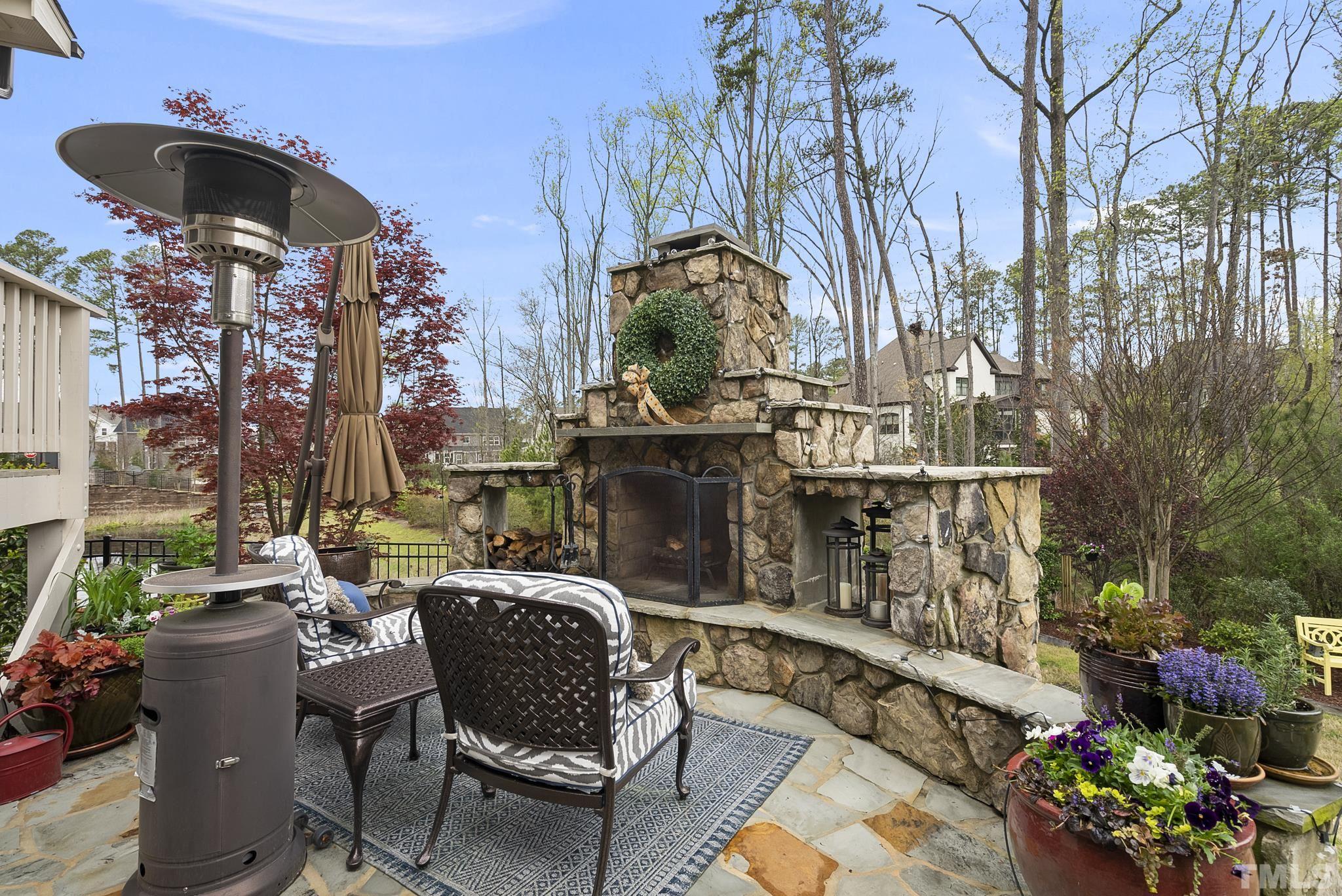 2524 Highgate Oak Drive Cary, NC 27519 - Photo 58 of 70 a view of a chairs and table in backyard