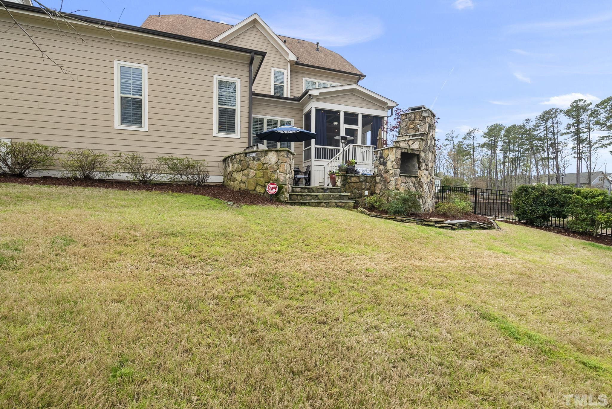 2524 Highgate Oak Drive Cary, NC 27519 - Photo 67 of 70 a front view of a house with yard and outdoor seating