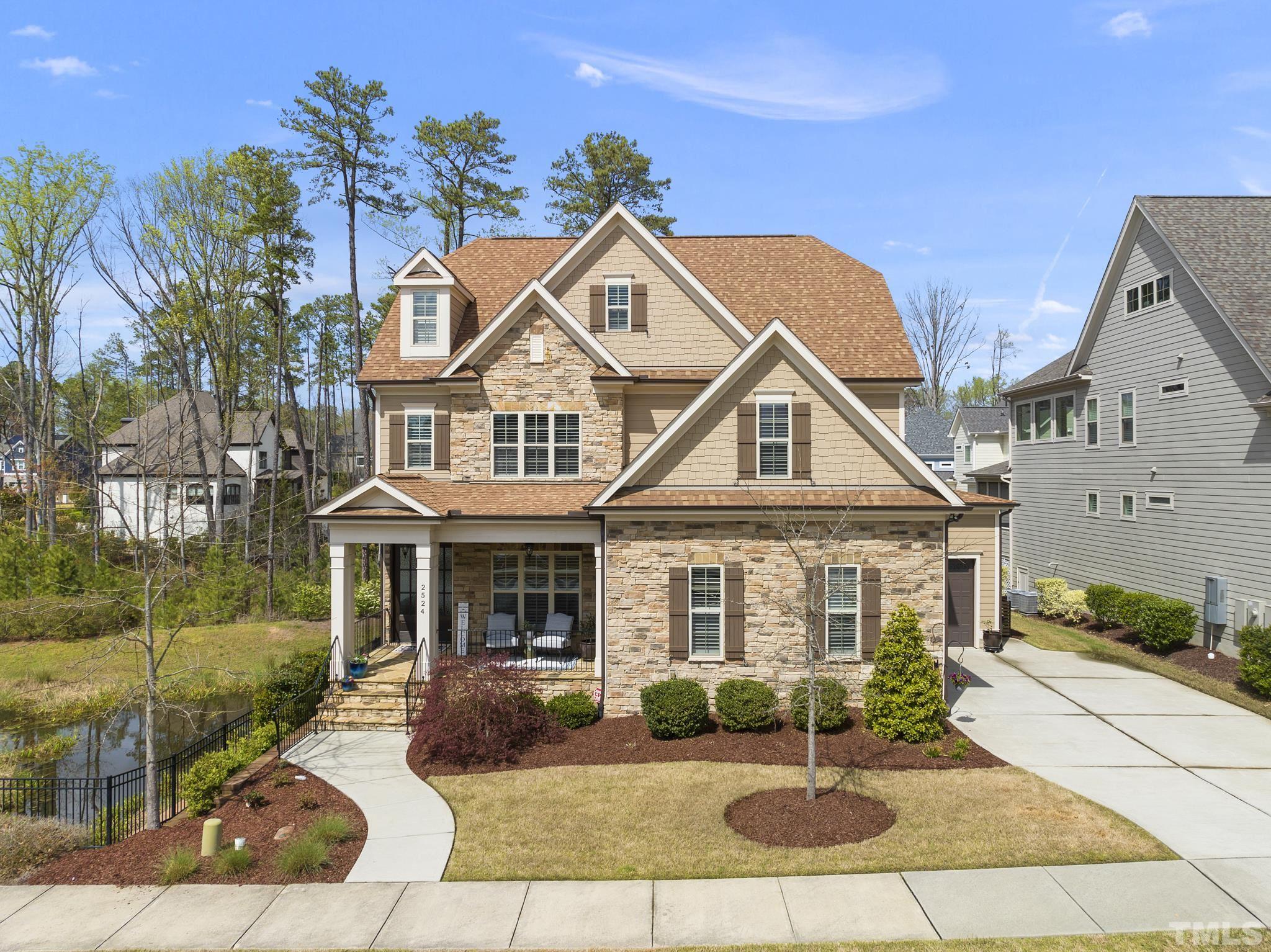 2524 Highgate Oak Drive Cary, NC 27519 - Photo 9 of 70 a front view of a house with garden