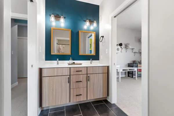 a bathroom with a sink and a mirror