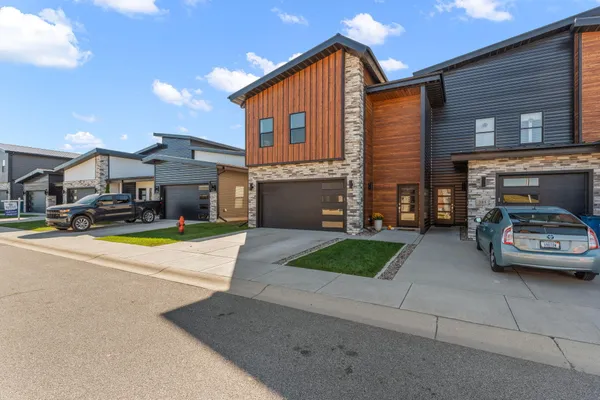 a view of a car parked in front of a house