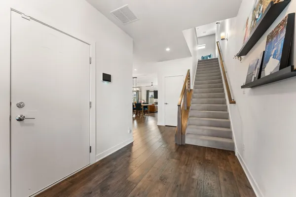 a view of entryway with wooden floor