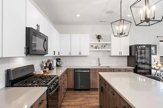 a view of a dining room with furniture wooden floor and chandelier