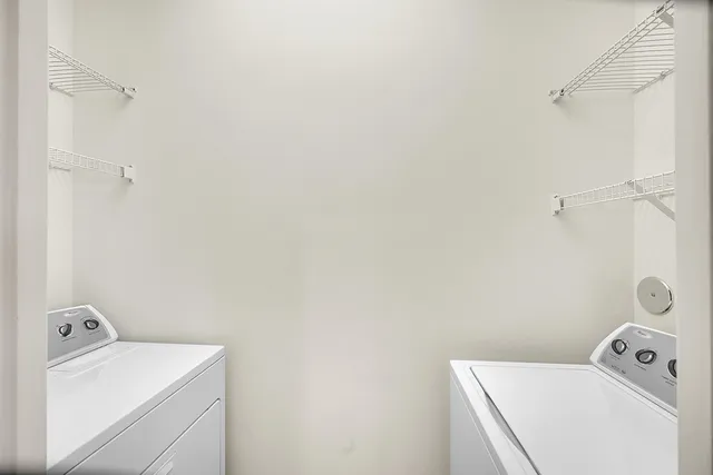 a bathroom with a sink and a washer dryer