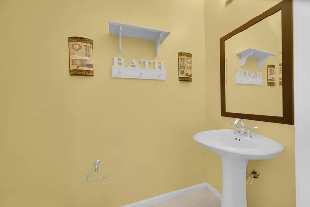 a bathroom with a sink and mirror