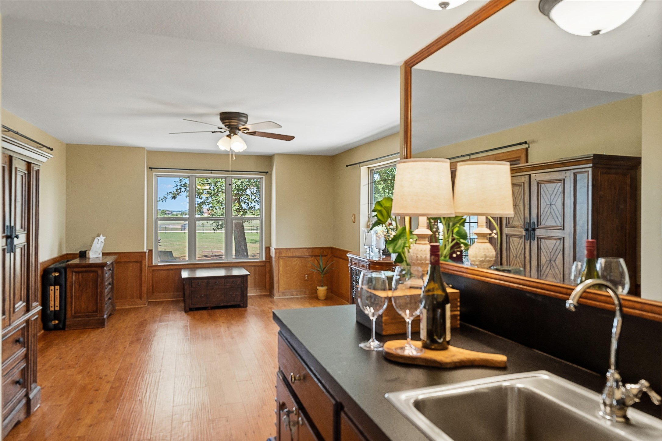 25948 Nelson Road Hempstead, TX 77445 - Photo 12 of 46 Kitchen view highlighting the open connection to the adjoining living area, abundant cabinetry, granite countertops, and natural light.