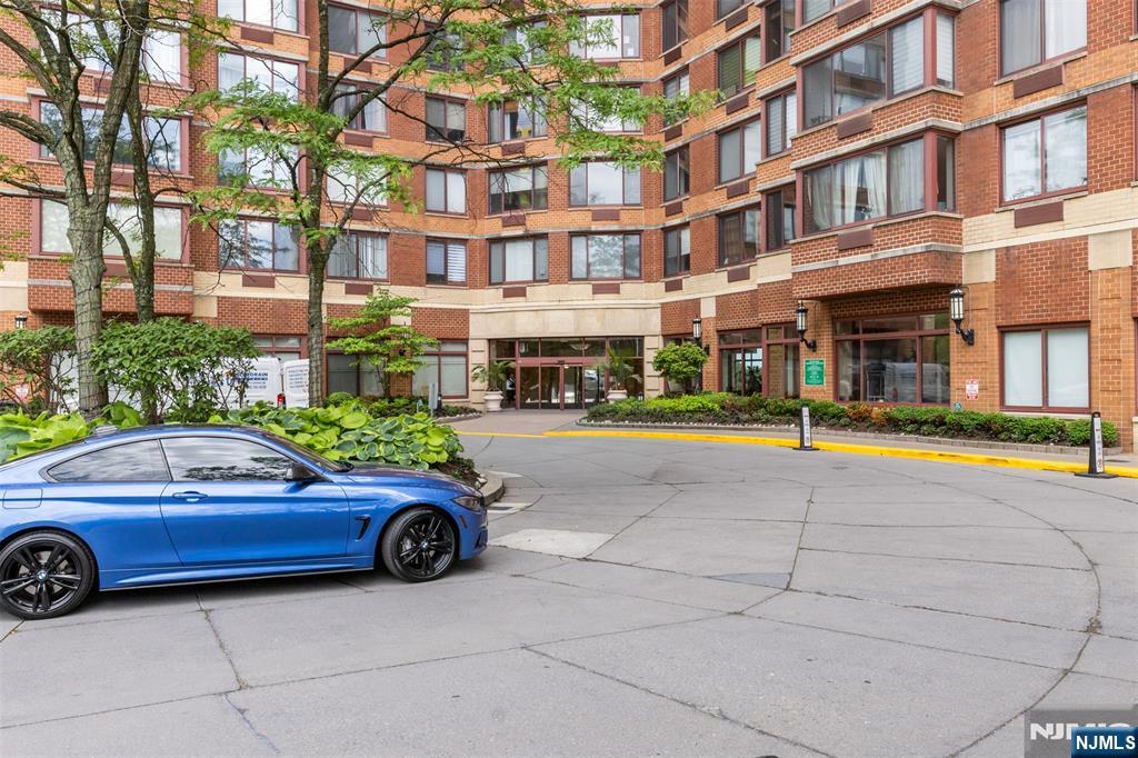 100 Old Palisade Road, Unit 3215 Fort Lee, NJ 07024 - Photo 40 of 43 a car parked in front of a building