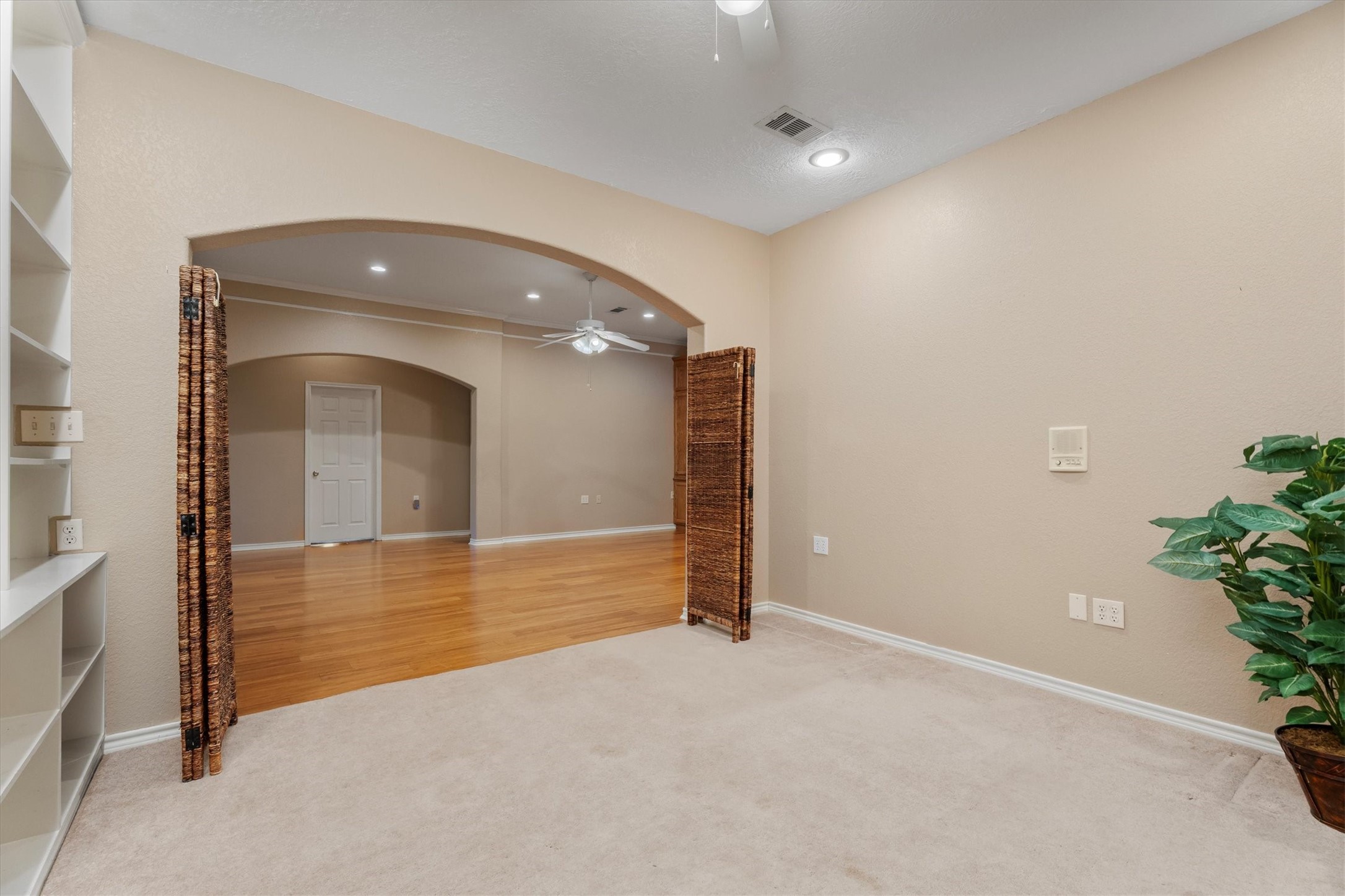 10205 Fostoria Road Cleveland, TX 77328 - Photo 11 of 44 an empty room with an entryway and a potted plant
